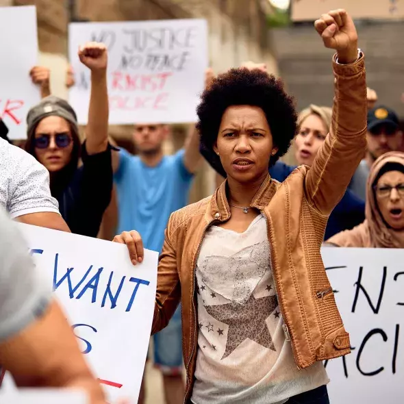 Black Female in Protest with Raised Fist