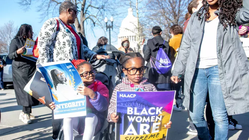Little Girl Holding Sign - Black Women Are Supreme Rally