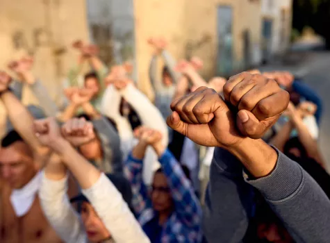 Group Holding Raised Fists in Protest