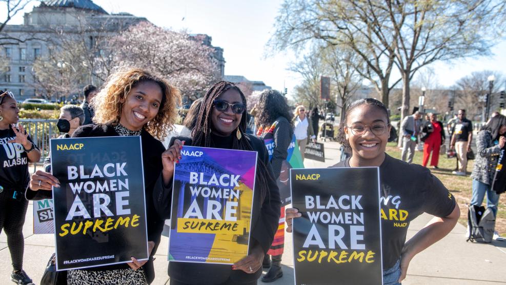Group at Black Women are Supreme Rally Holding Signs