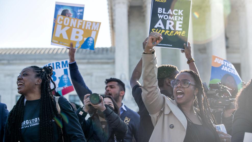 Group Holding Up Black Women are Supreme Signs