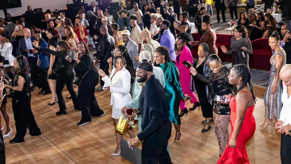 Guests dance during the 56th NAACP Image Awards Nominees’ Reception.