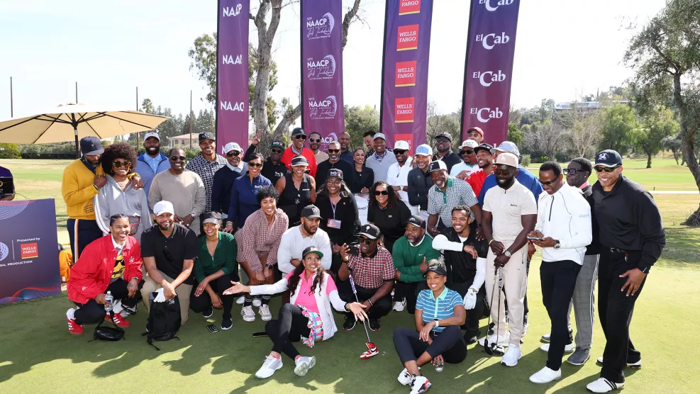 Several celebrities and hosts pose for a photo during the 56th NAACP Image Awards Golf Invitational at El Caballero Country Club.