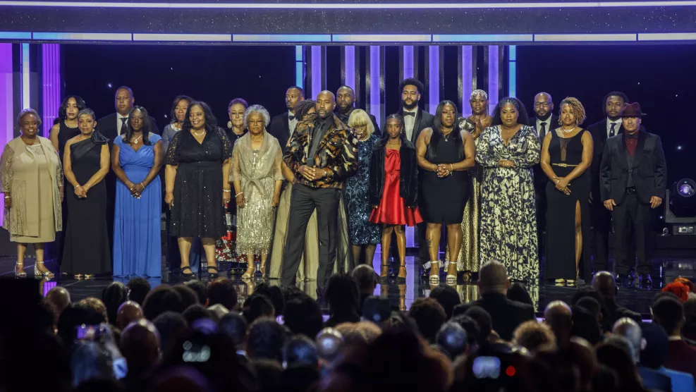 Actor Morris Chestnut onstage with 22 residents of Altadena, CA at the 56th NAACP Image Awards.