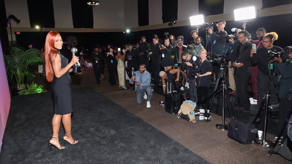 Keke Palmer poses with her Image Award at the 56th NAACP Image Awards in front of photographers.