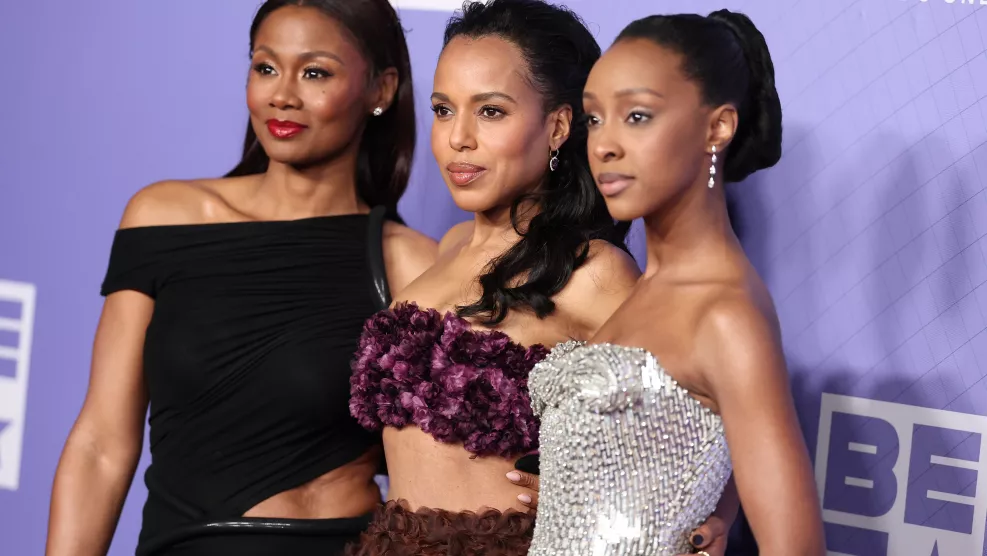 Actresses Emayatzy Corinealdi, Kerry Washington, and Ebony Obsidian on the red carpet at the 56th NAACP Image Awards.