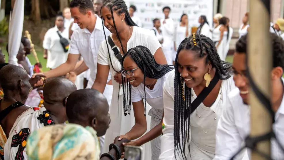 Fellows greet the Chiefs and Queen Mothers at Assin Manso before taking part in the “Last Bath” as they ventured down the trail African ancestors were forced to walk to be bathed for the last time before being traded into slavery.