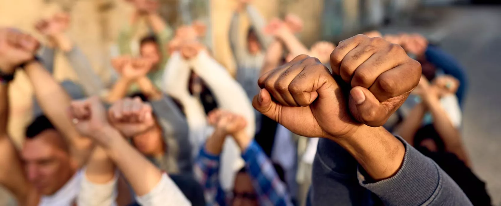 Group Holding Raised Fists in Protest