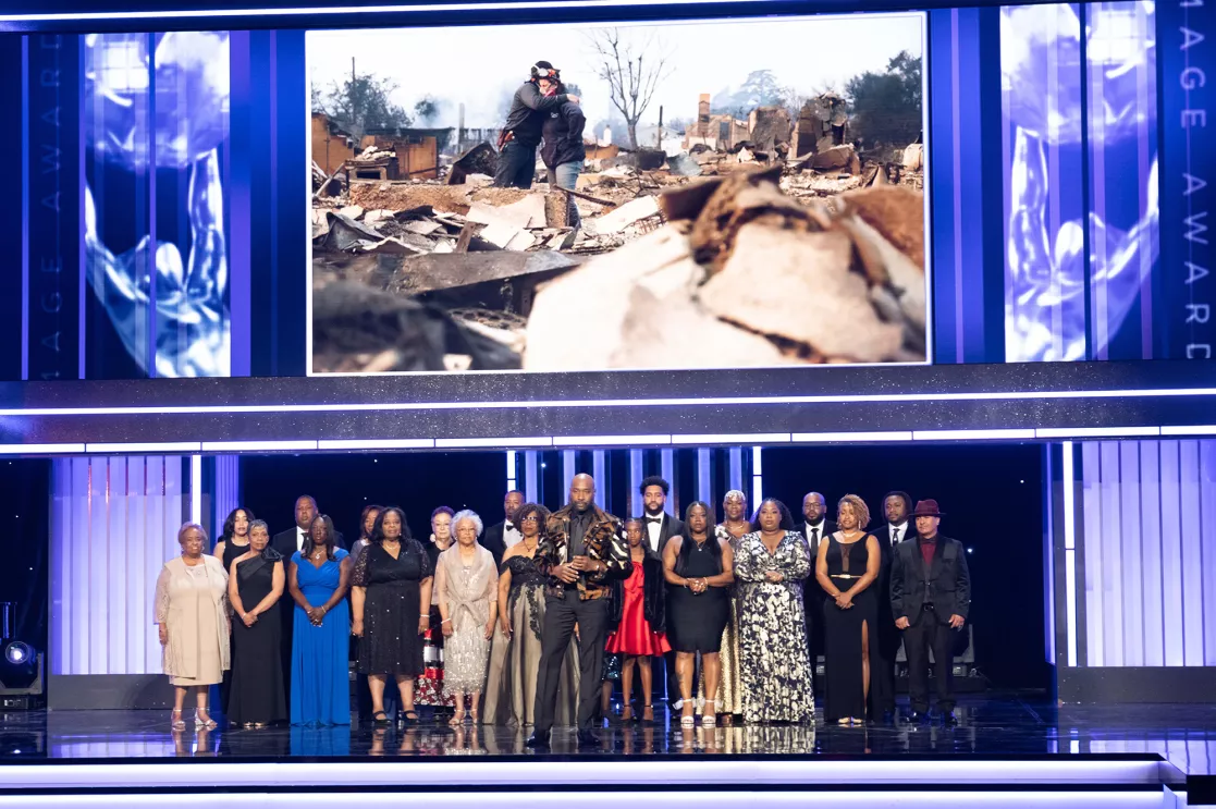 Actor Morris Chestnut onstage with 22 residents of Altadena, CA at the 56th NAACP Image Awards.