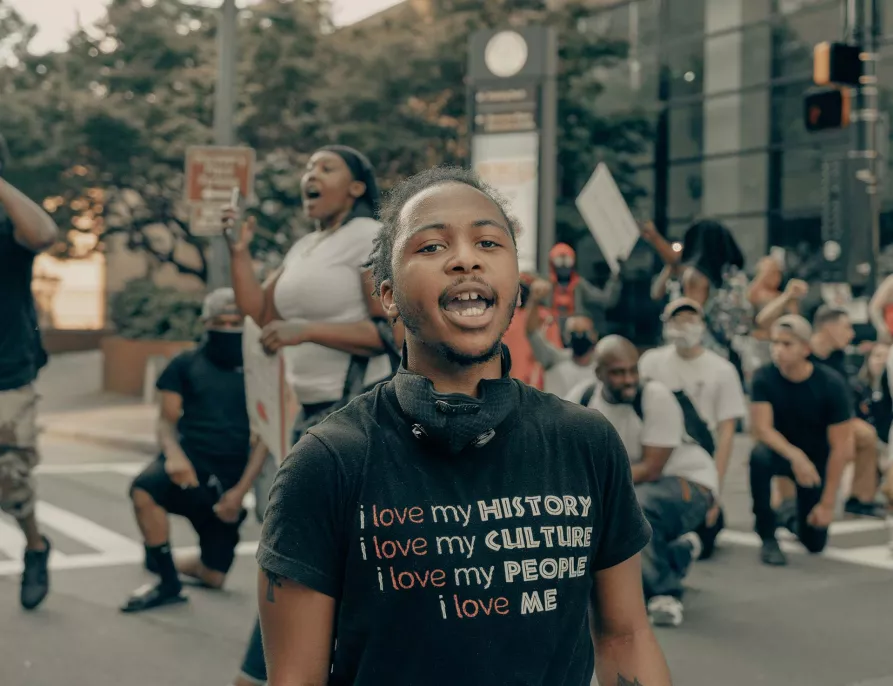 Young Black Male - Outdoors - in protest or rally - speaking