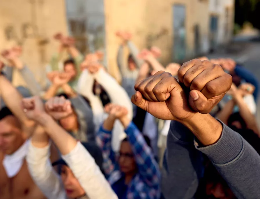 Group Holding Raised Fists in Protest