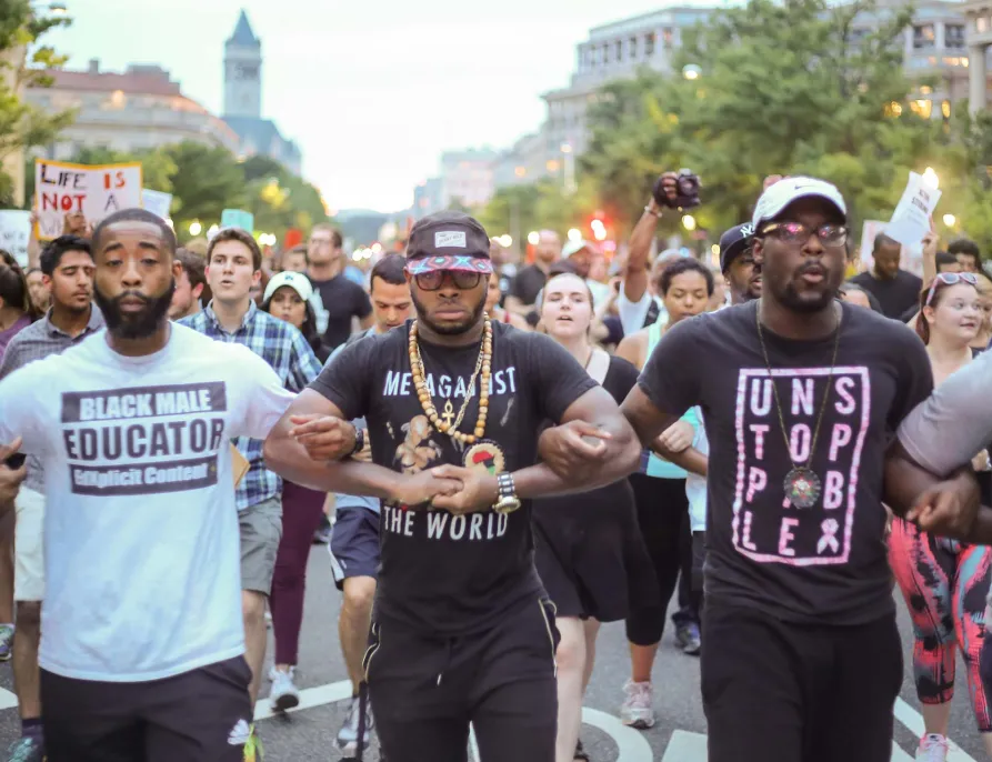 Black Men Locking Arms in Protest