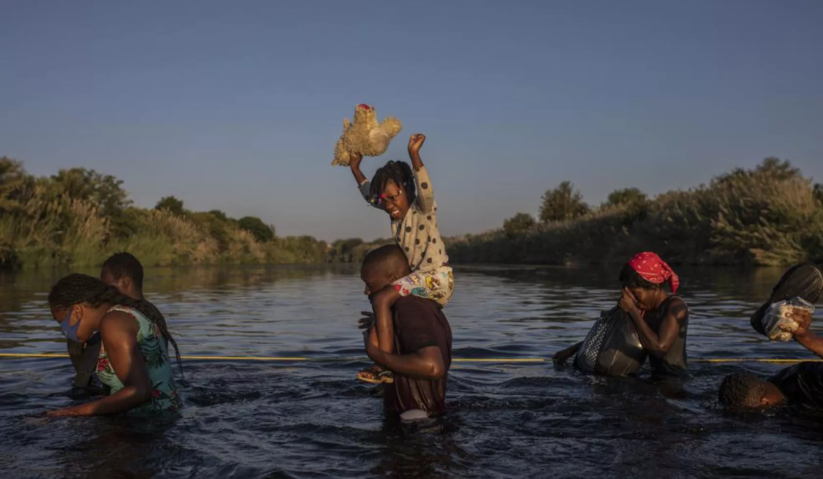 Haitians crossing the border