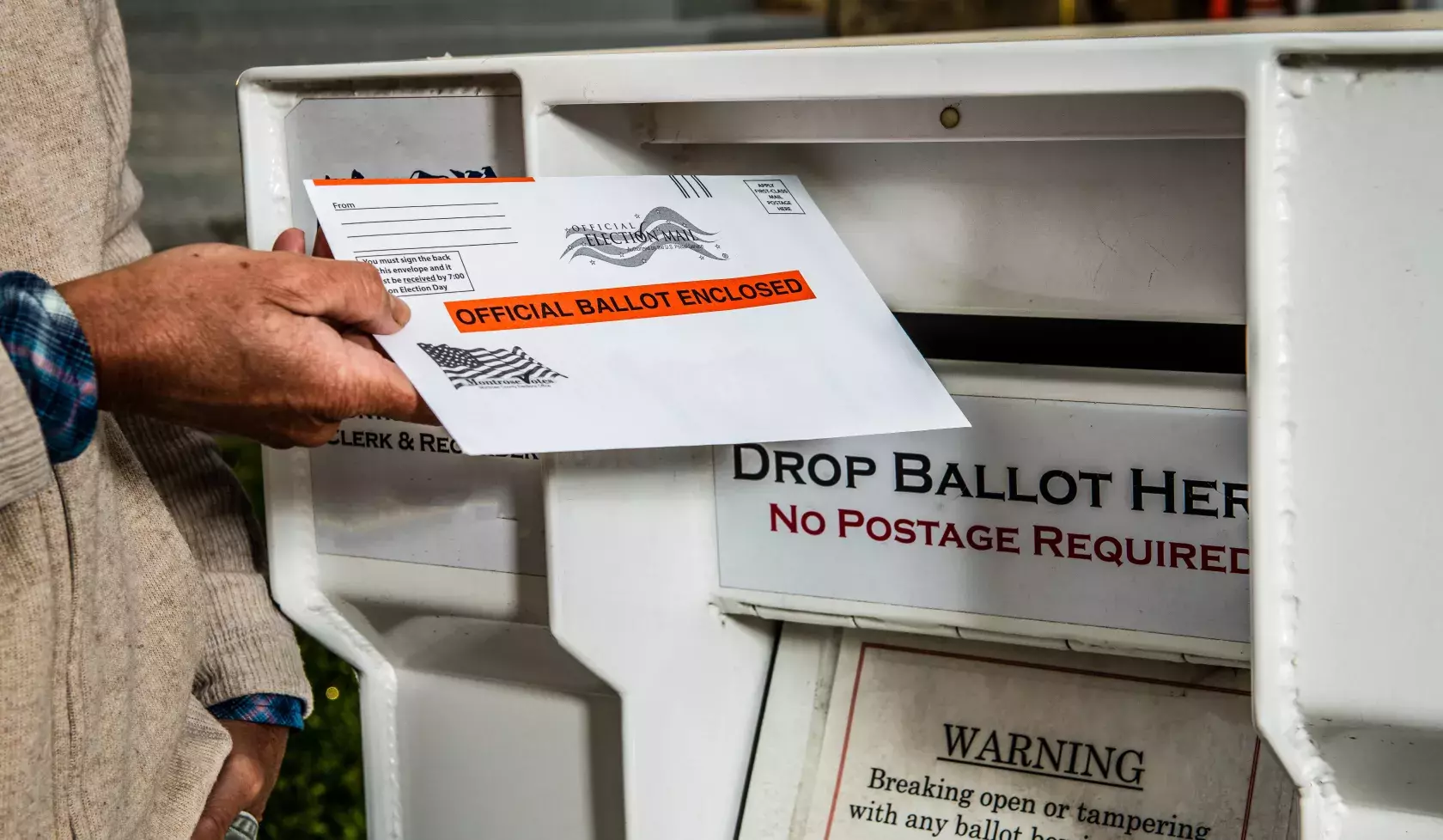 Black man voting by mail