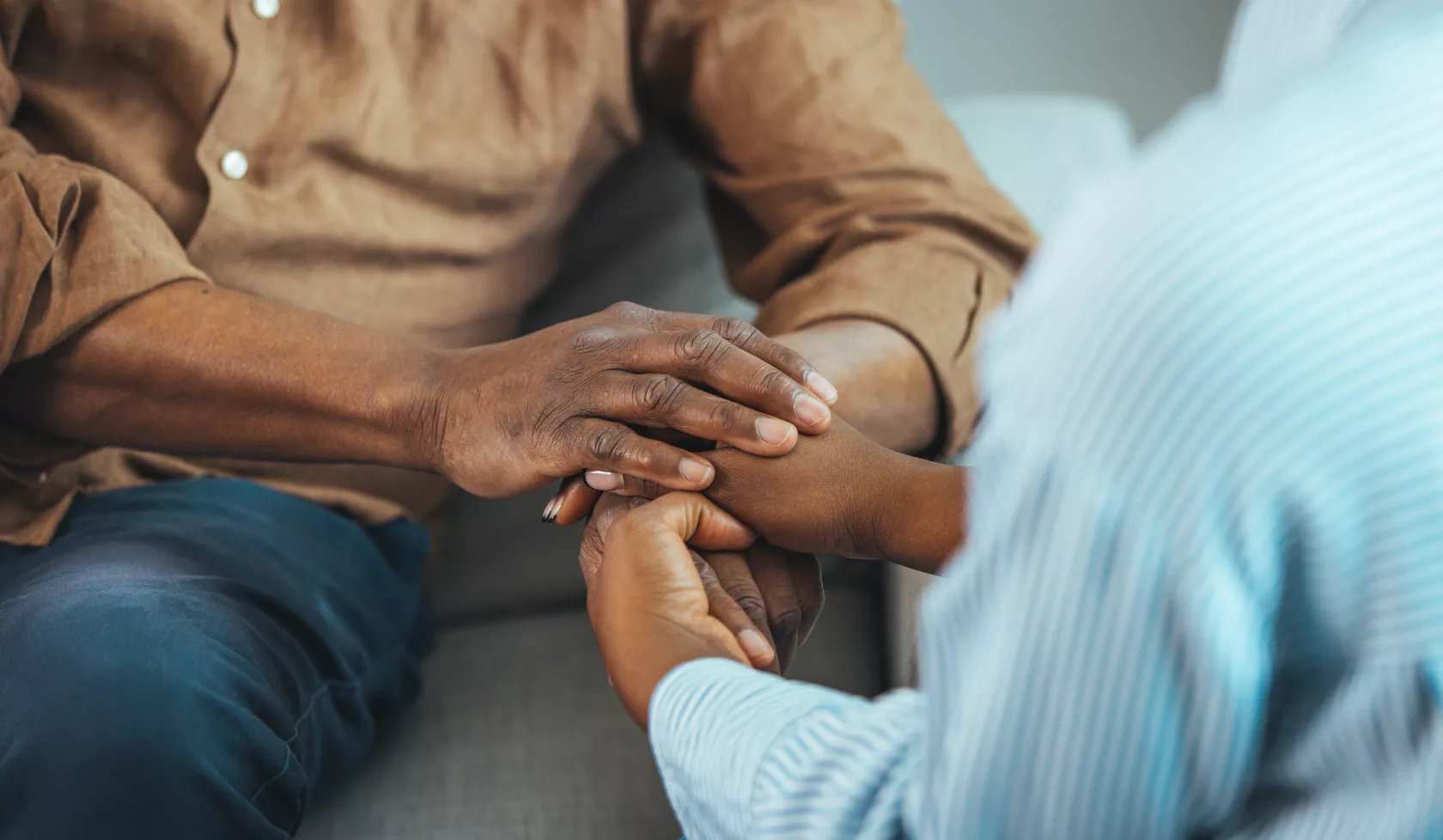 Two people holding hands.