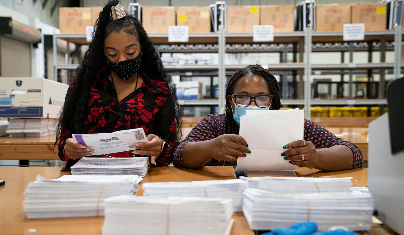 Black Female Election Workers - tallying election votes