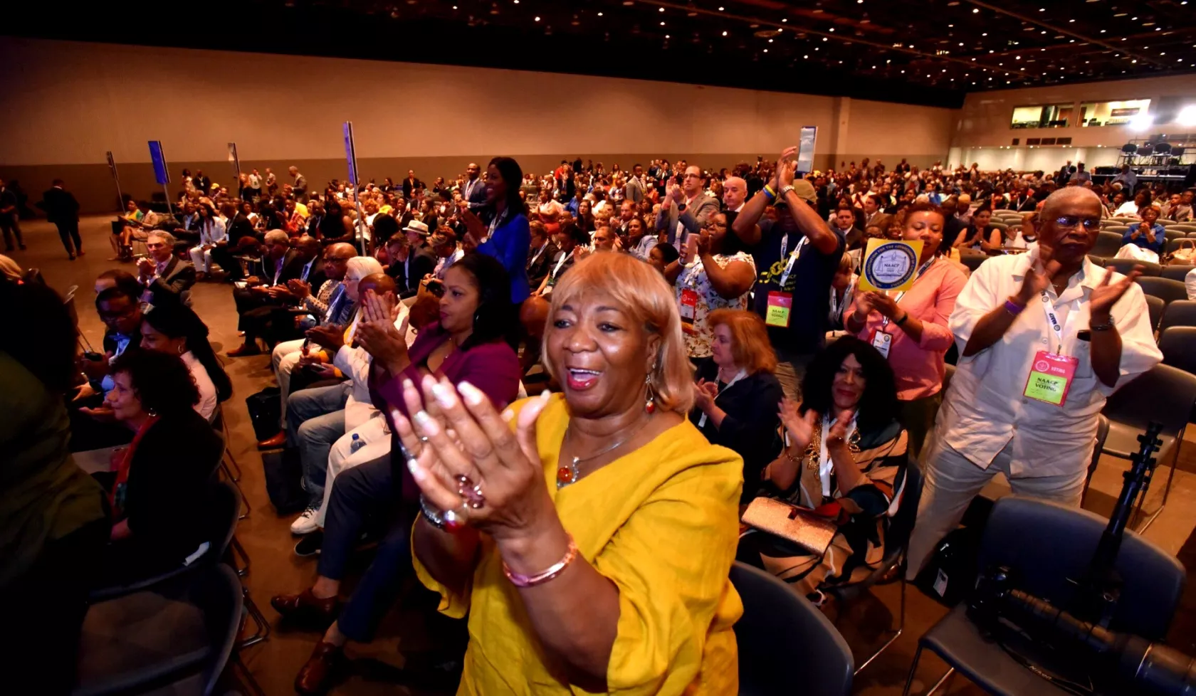 NAACP Members standing and clapping 