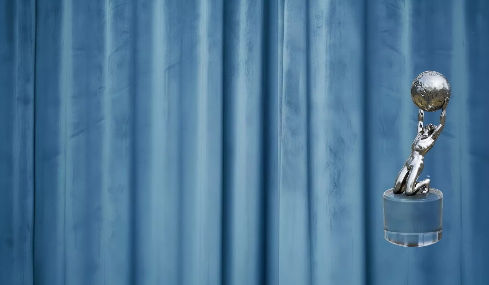 Blue curtain with silver Image Award trophy