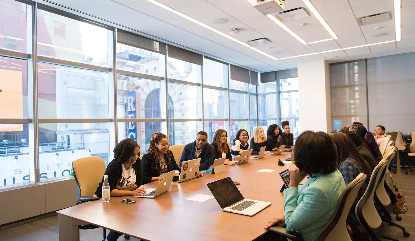 Group in Meeting - Office Setting - with Laptops