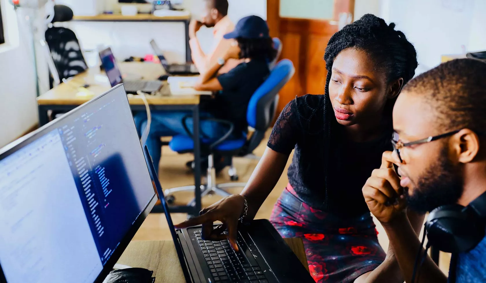 Black Male and Female - in Classroom setting - collaborating - on computer