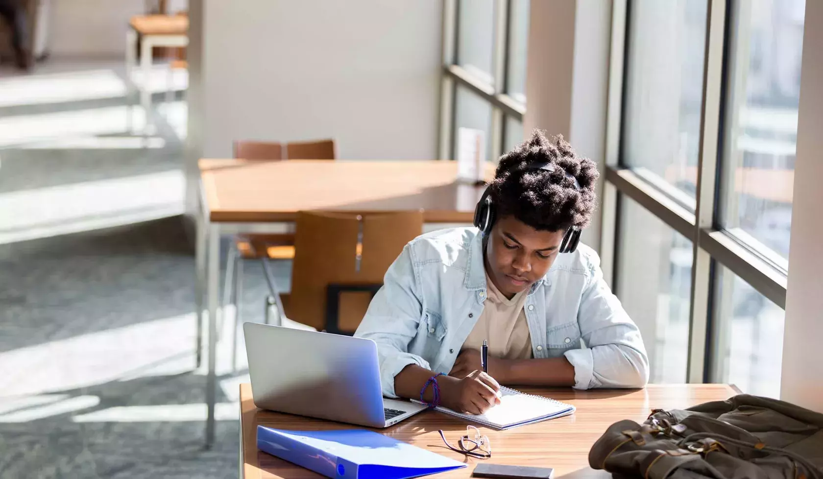 Young Black Student at Desk Working