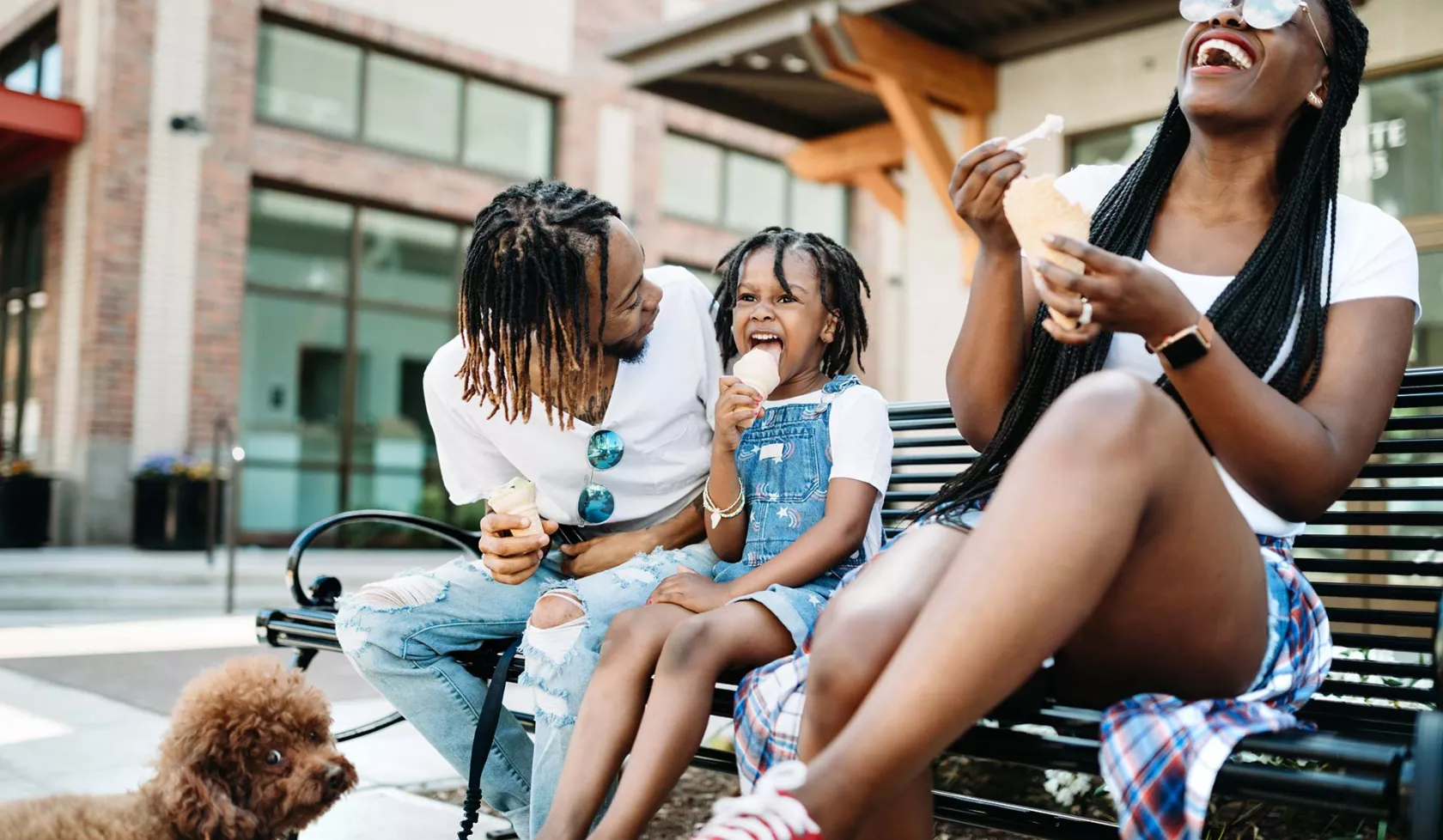 Young Black Family Outside Laughing