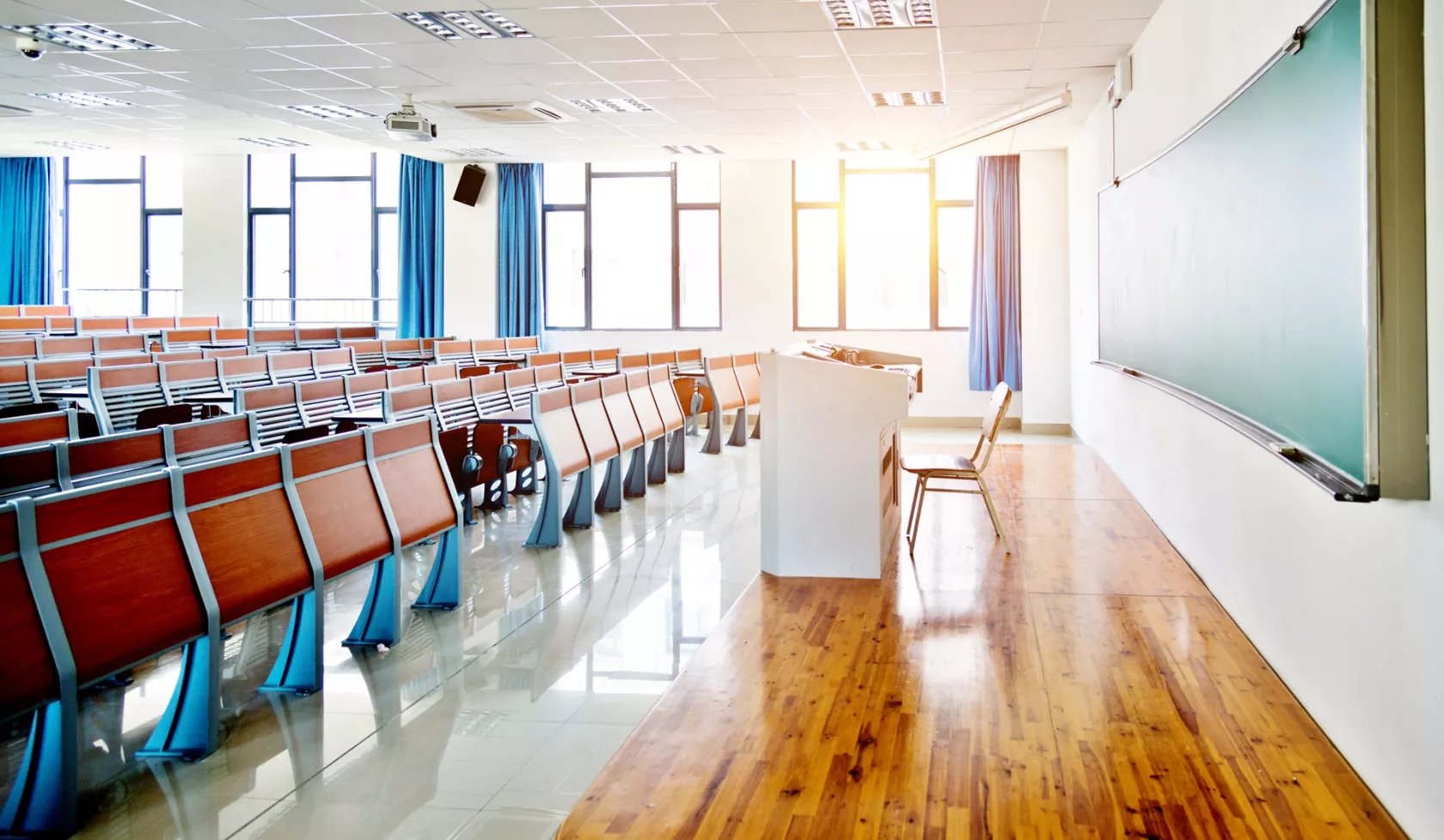 Unoccupied Classroom with Desks and Chairs in the Daytime