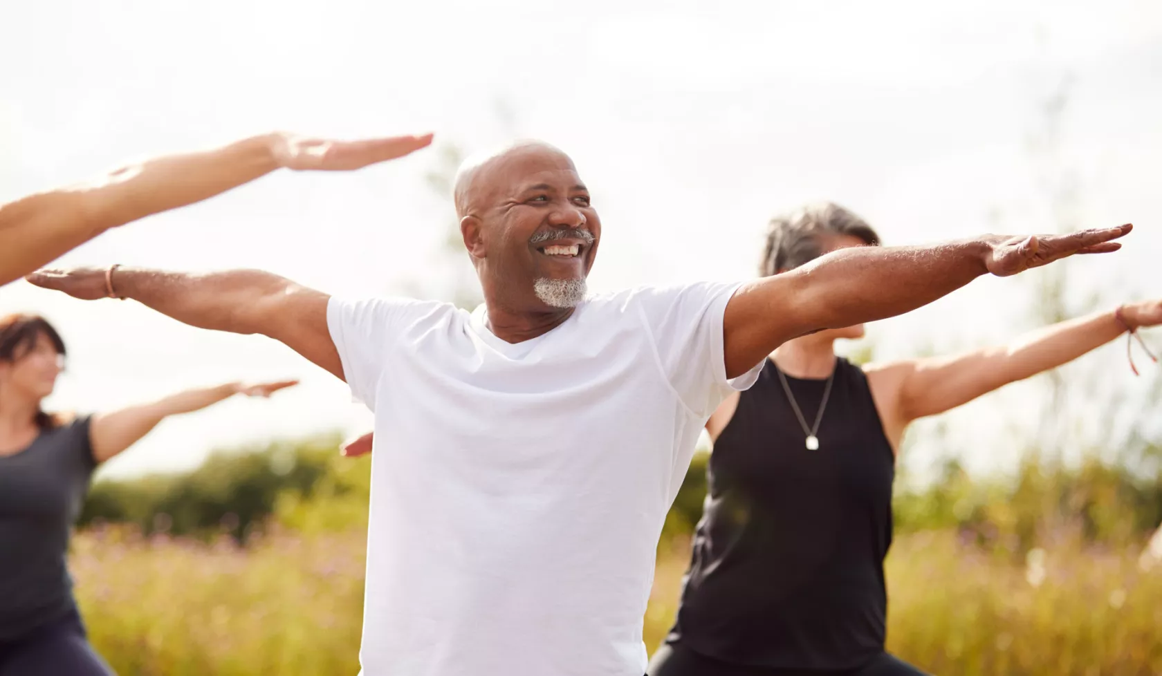 Group Enjoying Outdoor Yoga Class