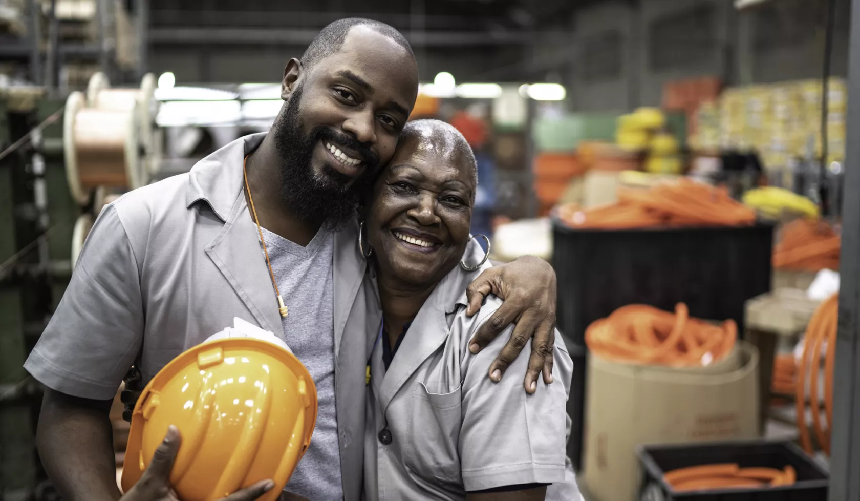 Happy Construction Coworkers Sharing a Hug