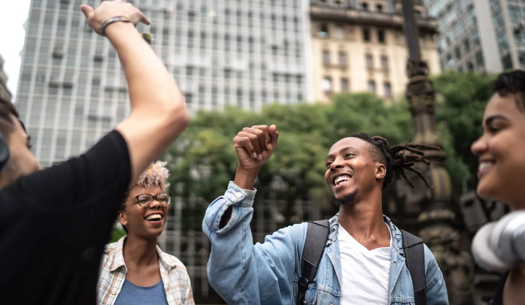 Group of Young People Having Fun and Dancing Together Outside