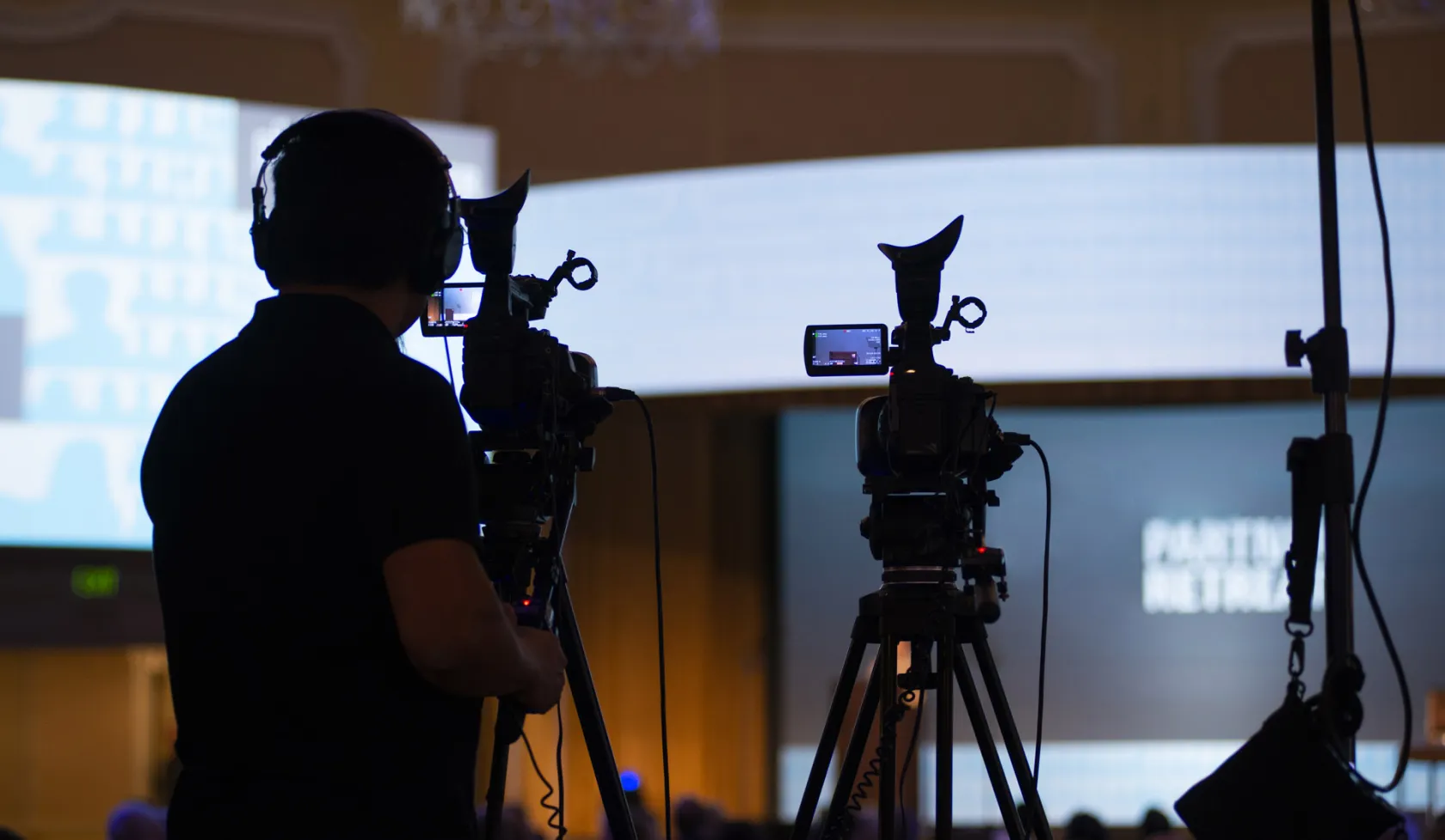 Videographer Filming a Show with a Studio Audience