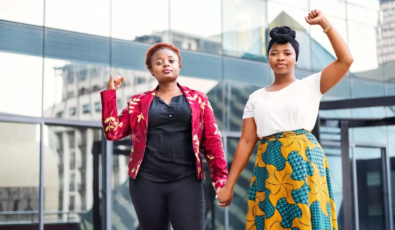 Young Black Females - Outdoors - Holding Hands and Raising Fists