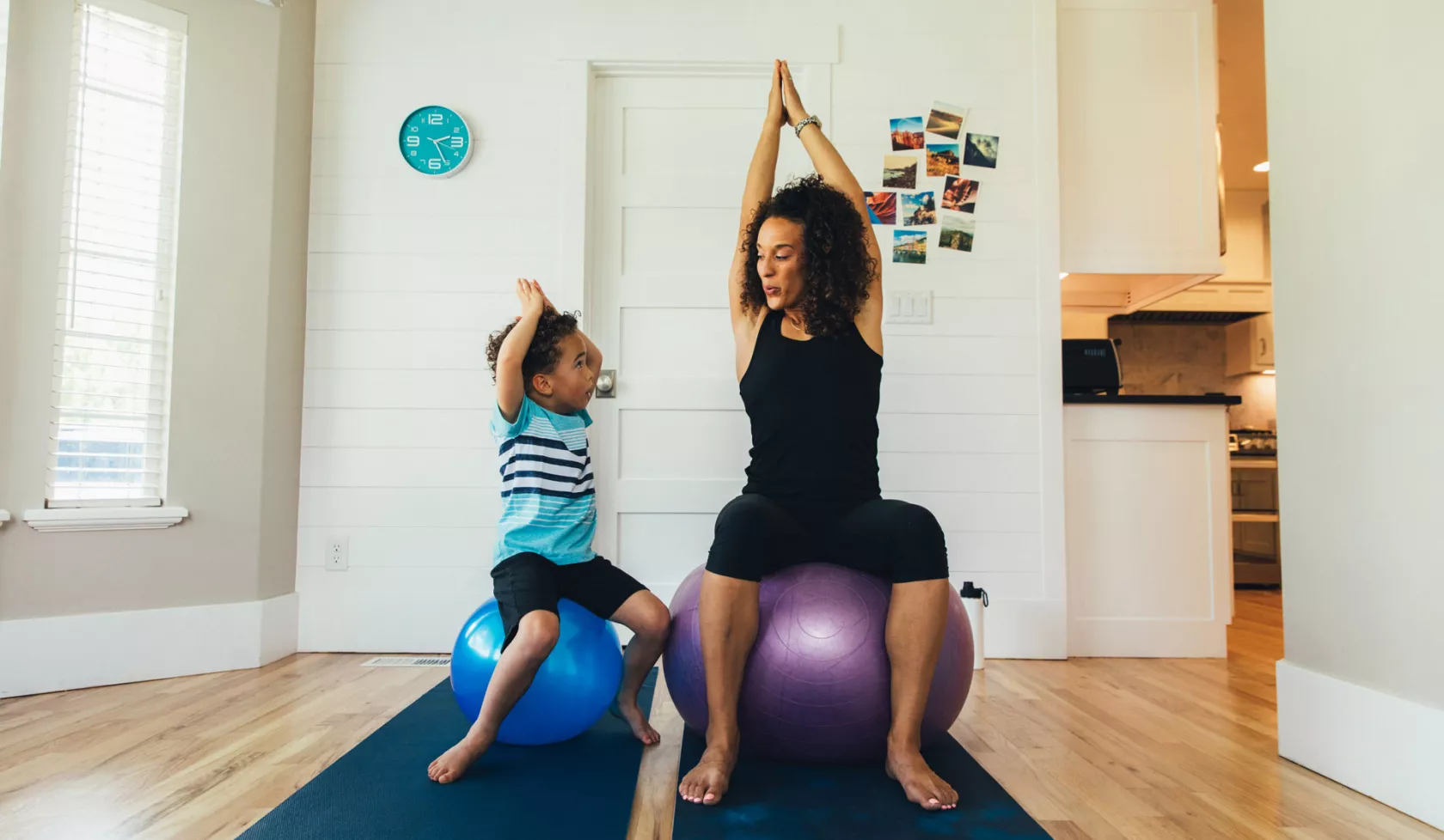 Mother and Child on Exercise Balls Inside Home