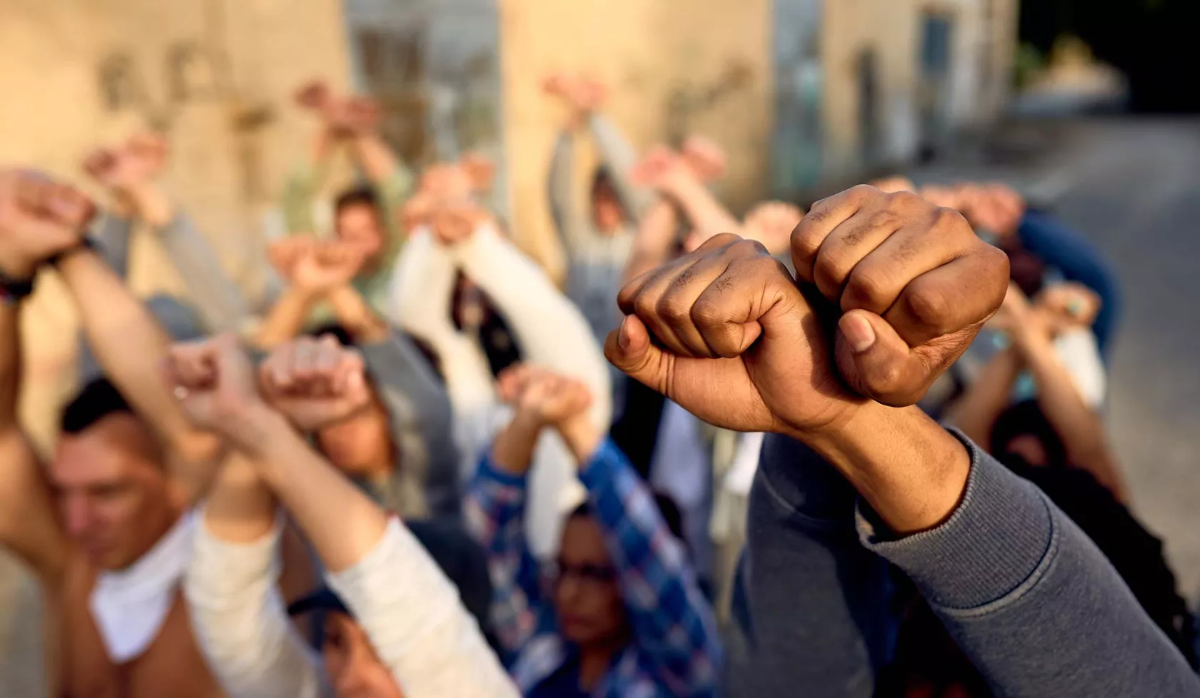 Group Holding Raised Fists in Protest