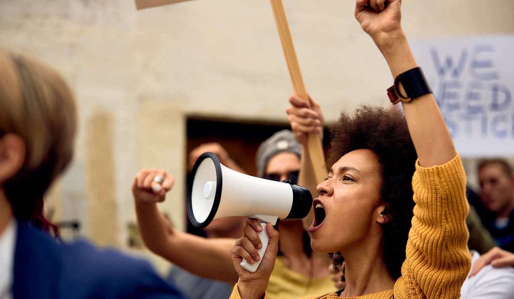 Black Female Protesting, Speaking into a Megaphone