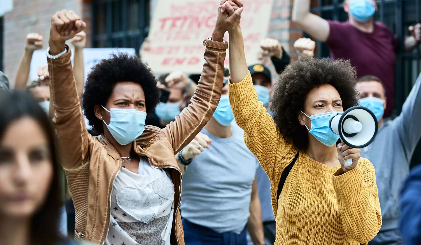 Black Females with Hands Locked in Protest