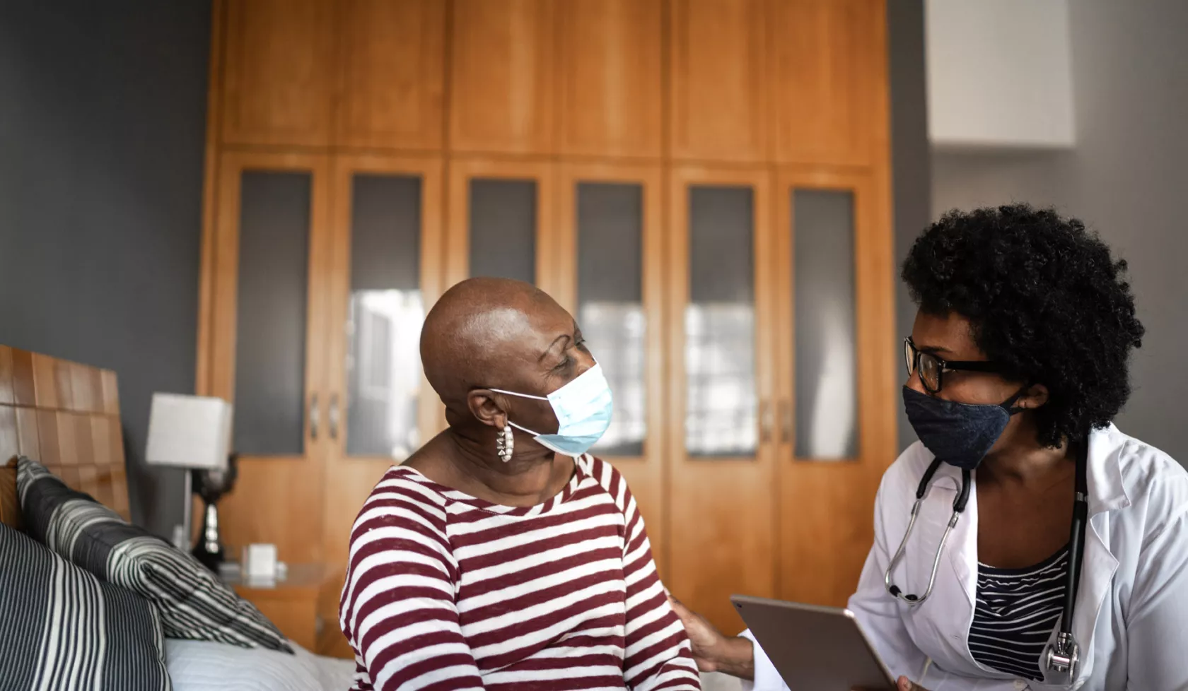 Older Masked Woman at Doctor's Visit