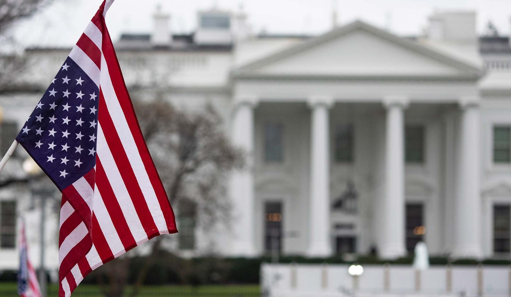 American Flag Hanging Outside of the White House
