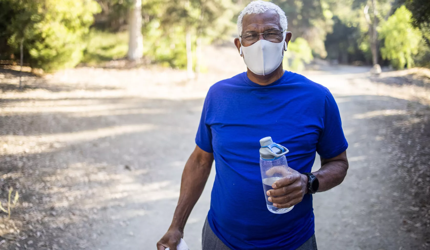 Masked Black Older Man Exercising Outdoors