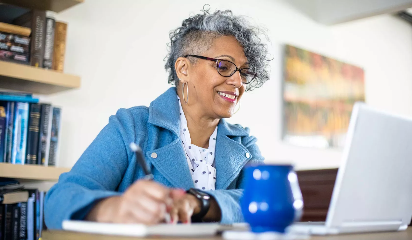 Woman Looking at Laptop Screen - Solo - Smiling