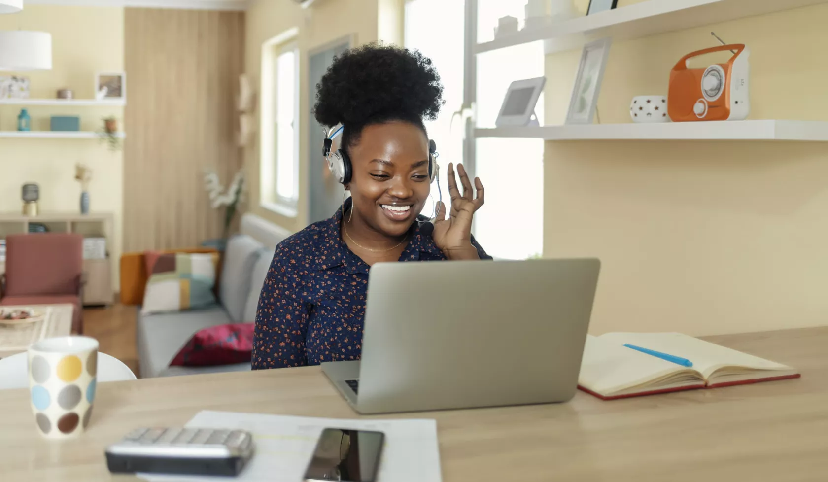 Black Woman Wearing Headphones with Laptop - Indoors