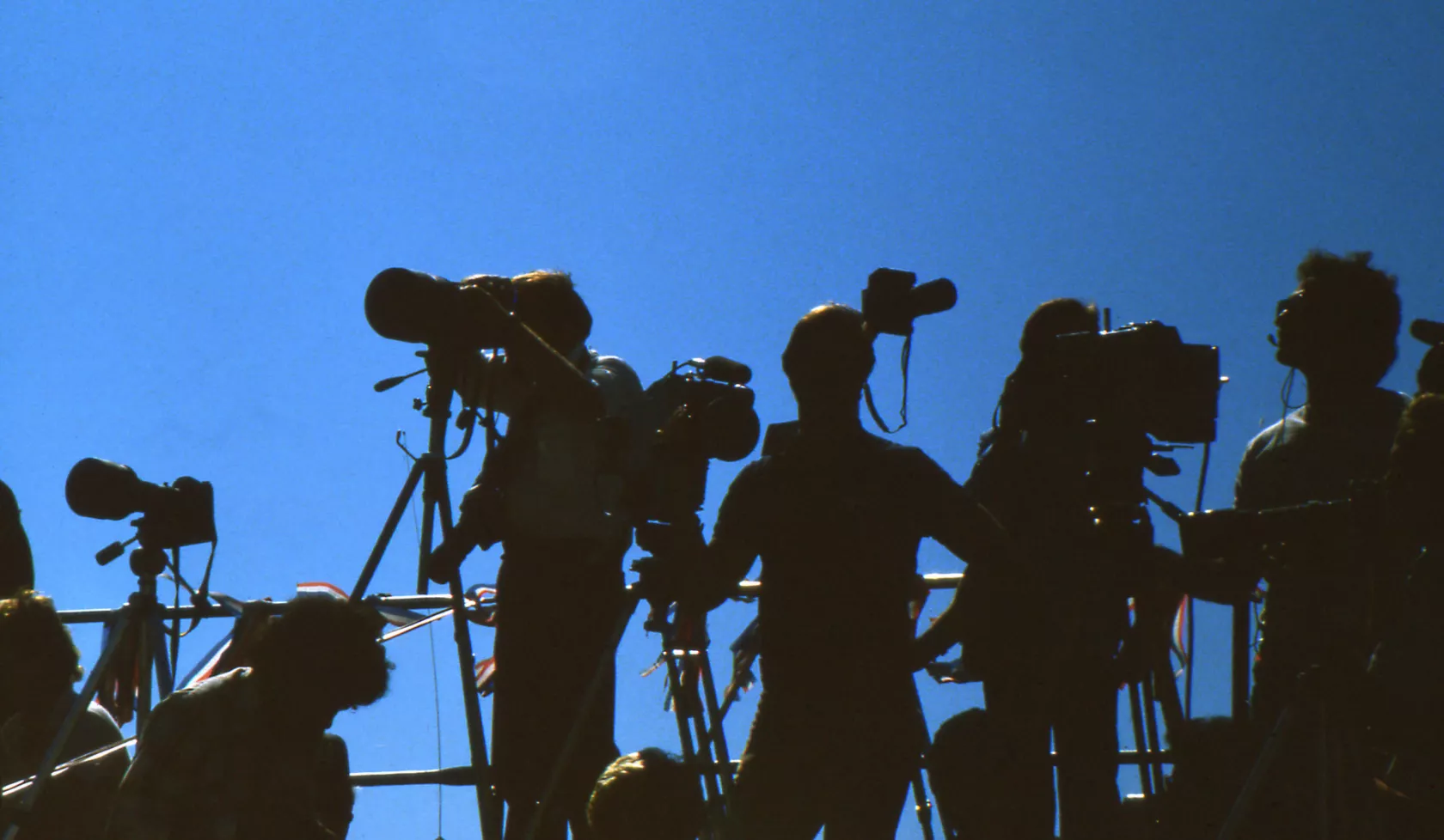 Shadowed View of Cameraperson Professionals - Outdoors