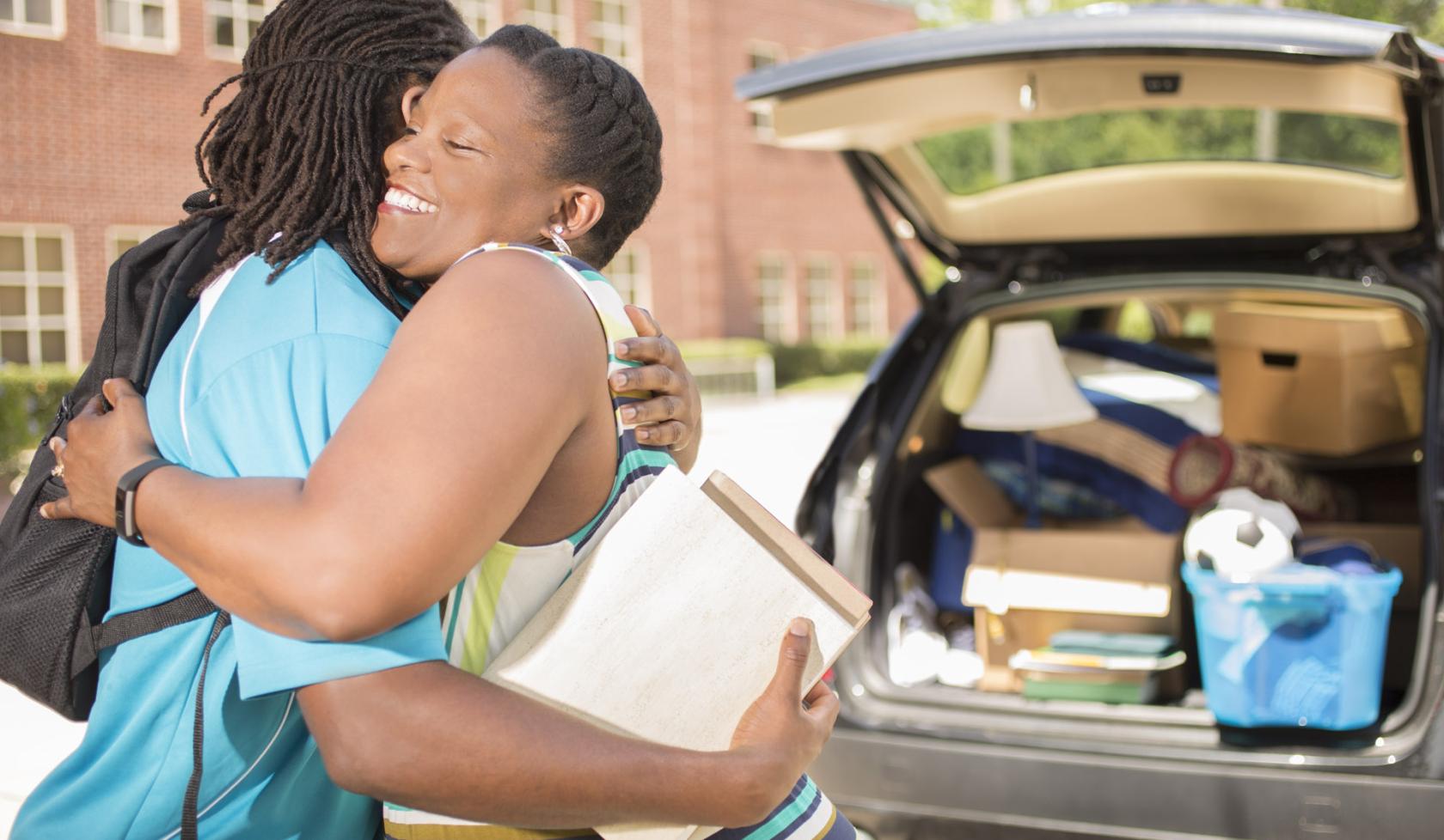 Parent Dropping College Student off at Campus with Car Full of Belongings