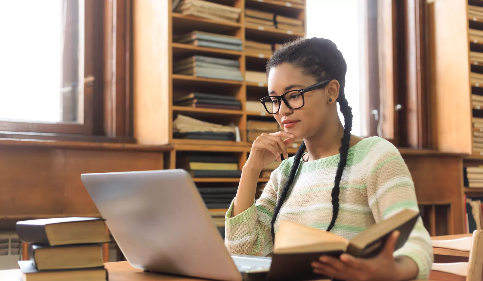 Young Black Student Working on Laptop and Studying Books