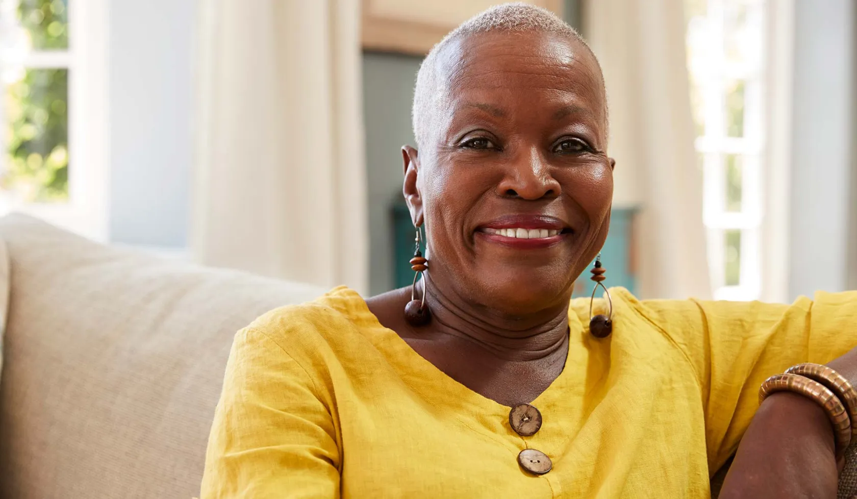 Close-up - Black Female - Solo - Smiling on Couch