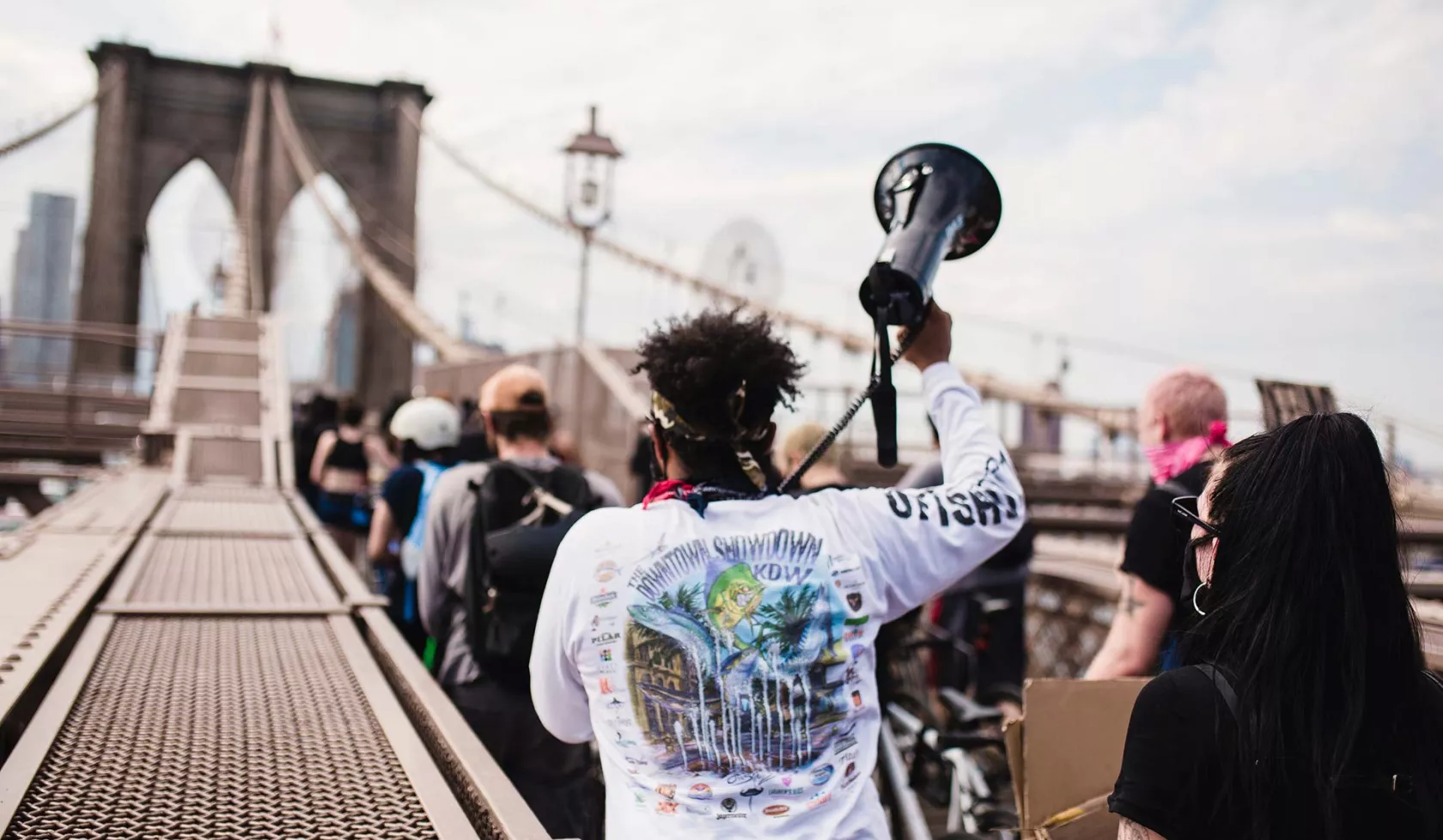 Group marching over Brooklyn Bridge