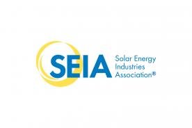 Yellow circular design behind large blue text reading SEIA, with smaller blue text to the right reading Solar Energy Industries Association