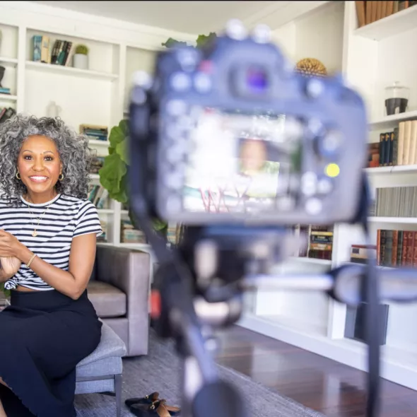 Black woman in front of camera speaking
