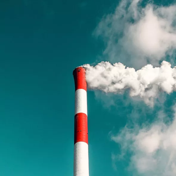 Smoke comes out of a factory