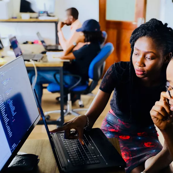 Black Male and Female - in Classroom setting - collaborating - on computer